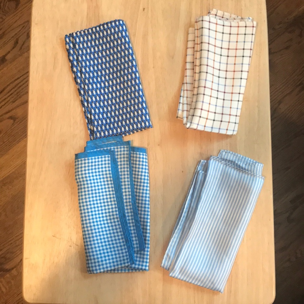 Set of four 100% silk pocket squares.